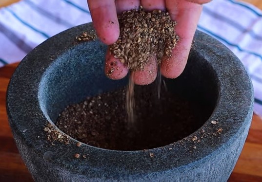 Grinding coriander for Droewors